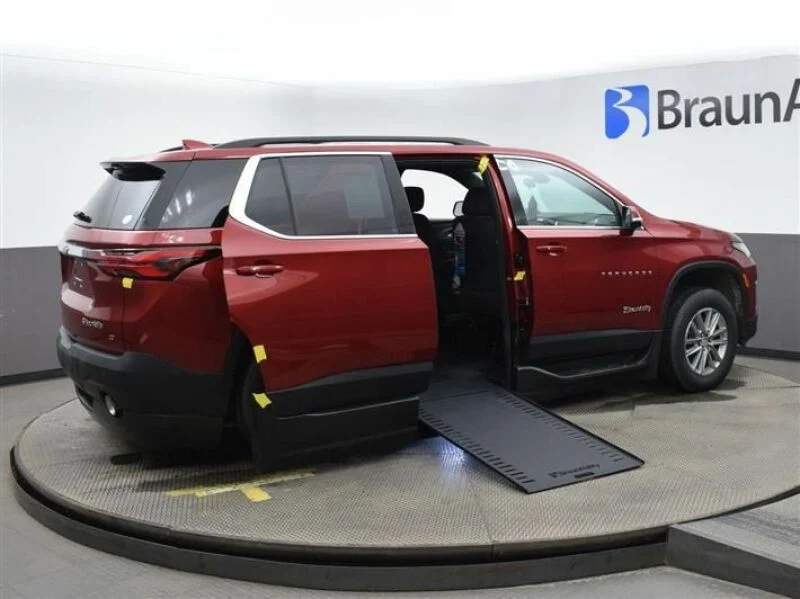 Side-entry Chevrolet Traverse wheelchair van in a showroom.