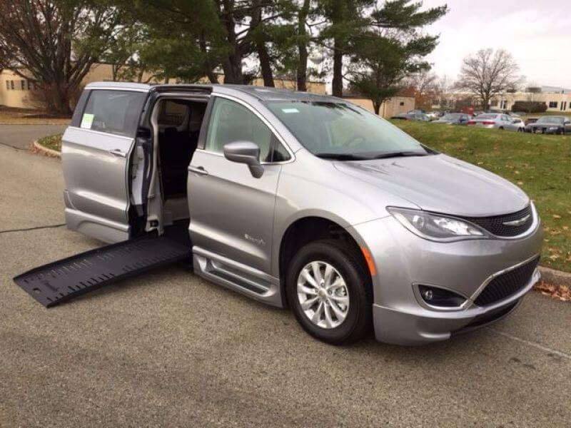 Chrysler Pacifica wheelchair van with a side-entry ramp extended.